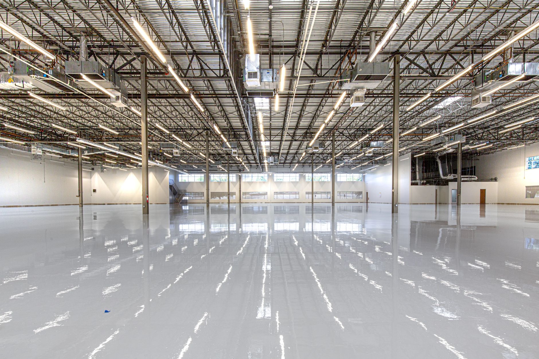 Industrial warehouse interior with a glossy seamless epoxy floor