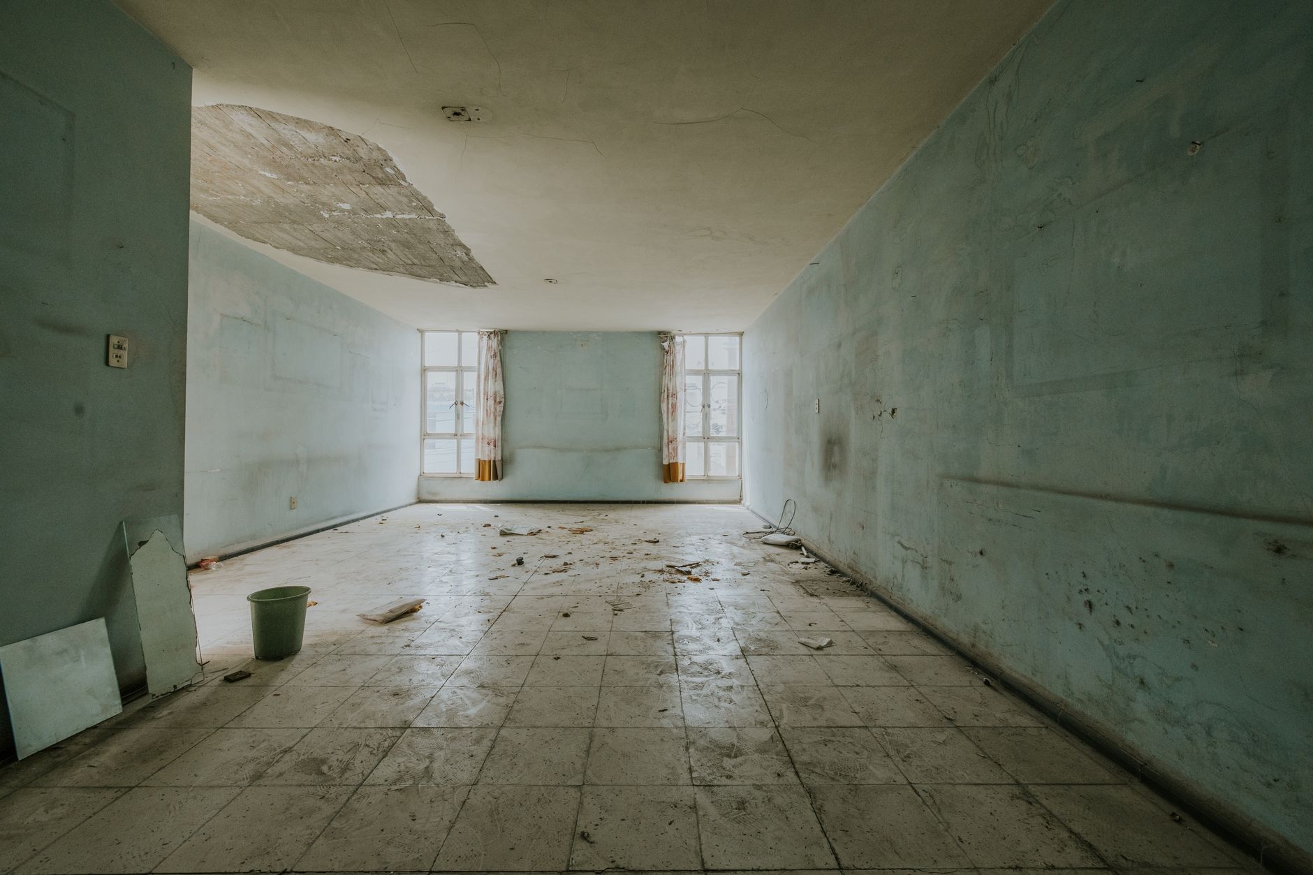 Interior with peeling ceiling finishes and visible moisture damage